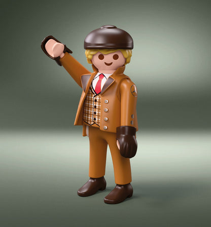 Figura Playmobil del set 72238 con traje camel, chaleco de cuadros, gorra plana y guantes de conducir
