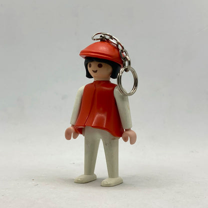Llavero Playmobil vintage Campesina Roja 30664160 con gorro y cuerpo rojos, cabello negro y extremidades blancas