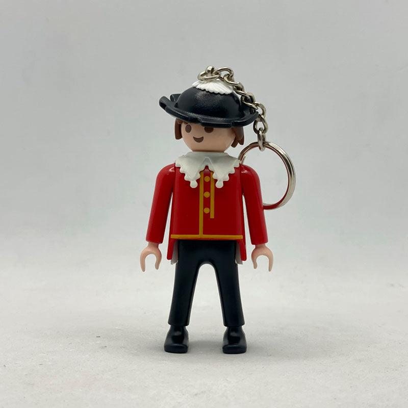 Llavero Playmobil Músico Stadtjugendkapelle Zirndorf con casaca roja de botonadura dorada y tricornio negro
