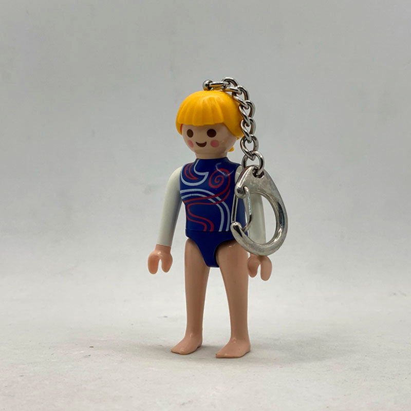 Llavero Playmobil Gimnasta con maillot azul de espirales, pelo rubio con coleta y mosquetón metálico