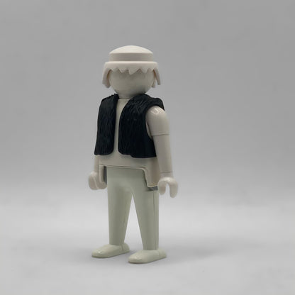 Chaleco de lana negro de Playmobil CHA022, sin mangas y con la textura del vellón moldeada, puesto sobre una figura blanca que no está incluida