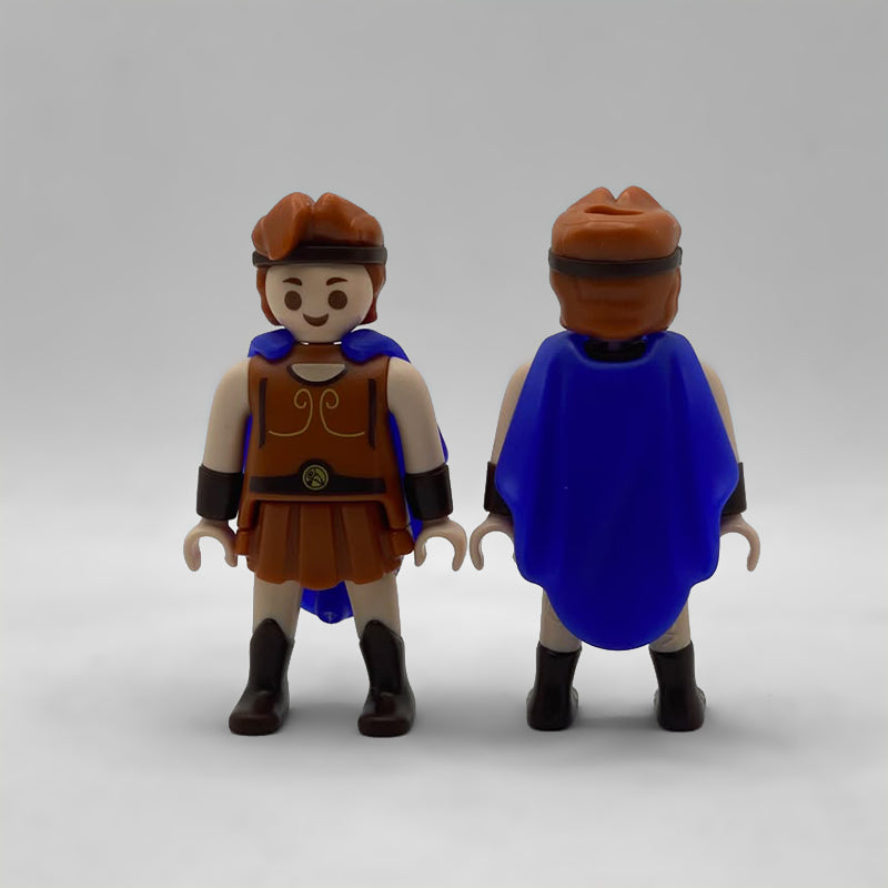 Playmobil Hércules Kinder FCO993 de frente y de espalda, con la capa azul cubriendo el torso por detrás